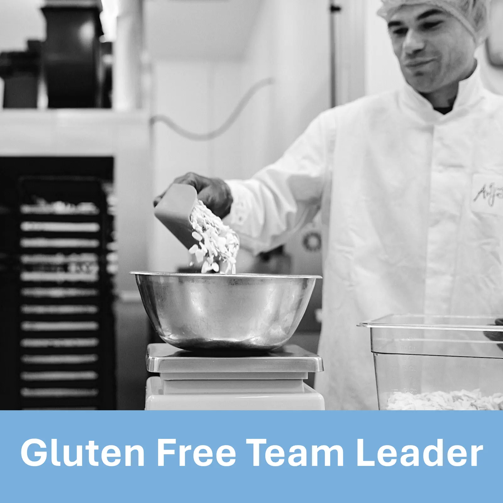 Black and white photo of a man in hairnet and bakery uniform weighing flaked almonds in a bowl on a set of scales. Text underneath reads Gluten Free Team Leader.